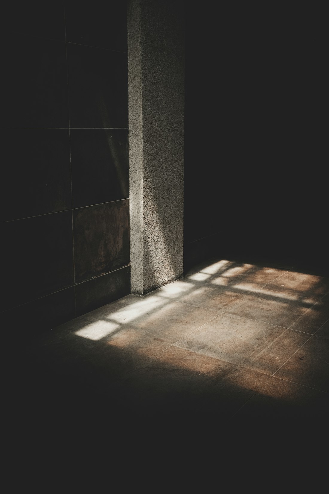 A shaft of daylight entering a dark interior